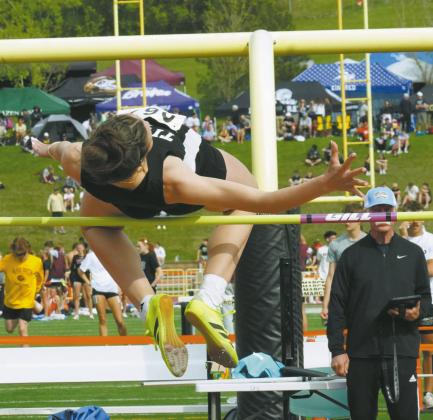 Senior Elizabeth Fedje defends her Class B State Champion title once again, placing first in the high jump at the Class B State Track Meet in Bismarck. Photo by Larry Stokke