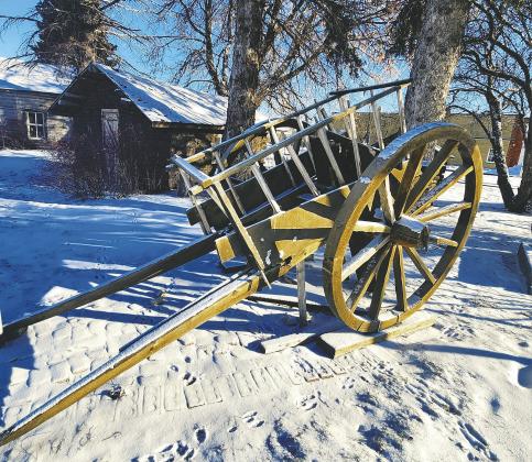 The ox cart sitting beside Blessing Museum. Photo by Hilary Nowatzki.