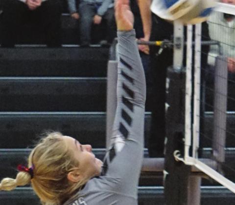 Ella Kittelson goes for a kill in action against MPCG in Drayton last week. VNV Photo by Lyle Van Camp
