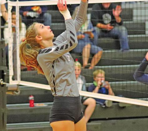 Chloe Gemmill goes up for the kill against the Patriots in Drayton. VNV Photo by Lesa Van Camp