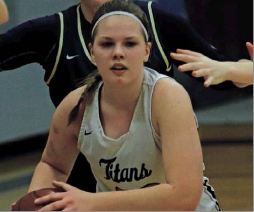 Kasey Stegman looks for an open Titan before being surrounded by Eagles on Monday. VNV Photo by Lesa Van Camp