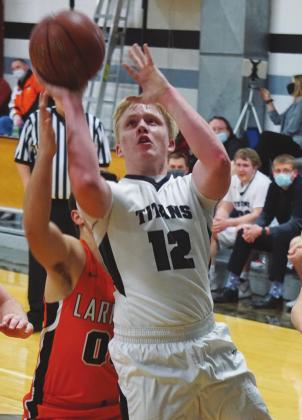 Caleb Kartes puts up a two point attempt in action against Larimore. VNV Photo by Lyle Van Camp