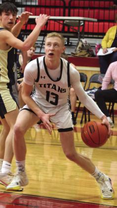 Connor Hurtt heads to the basket in action against North Border.