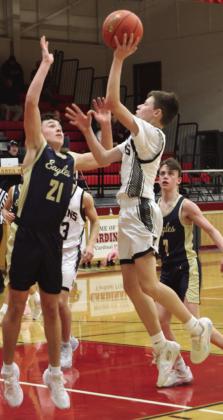 Drew Passa goes up against North Border’s Brody Berg at the District 3 Tournament.