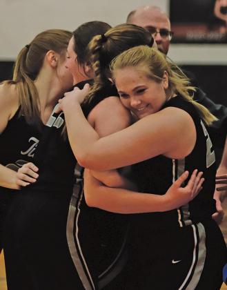 The Titan ladies celebrate their win following a hard fought win in the first round to advance to the quarterfinals at the Betty in the Region II Tournament. VNV Photo by Lesa Van Camp