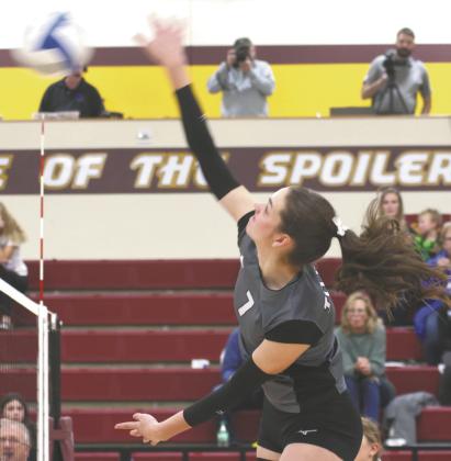 Elizabeth Fedje puts down a kill in regional tournament action Monday evening in Grafton. Photo by Lyle Van Camp