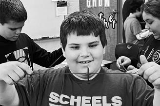 A student playing with a whirl-i-gig.