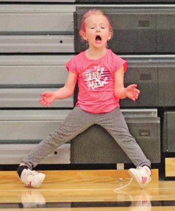 Brooke Corrick cheers on her favorite Titans Volleyball players in the Drayton gym last week. VNV Photo by Lesa Van Camp