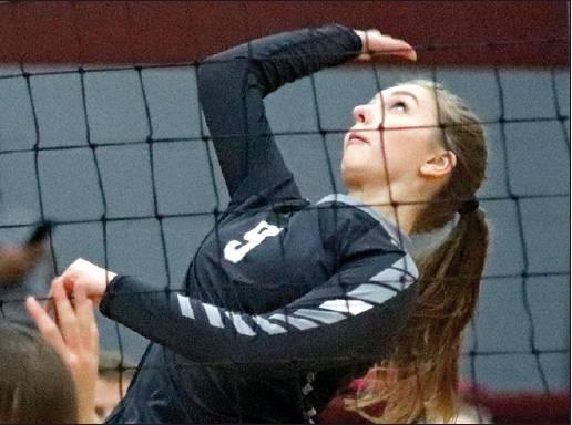 Chloe Gemmill spikes the ball across the net to Midway Minto Monday night. VNV Photo by Lesa Van Camp
