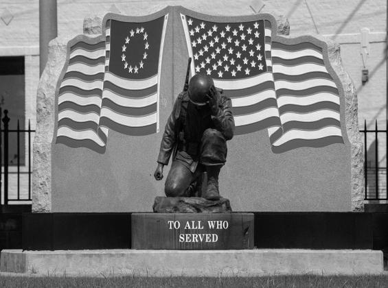 Memorial Statue located at Fort Smith, AZ National Cemetery. Located on a beautiful lawn and garden area, the cemetery is the home of thousands of gravestones of brave fallen soldiers, known and unknown.