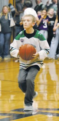 Kyle Johnson takes the half-court challenge from Nodak Insurance during half-time at Thursday's game in Crystal. Photo by Jamie Rarick