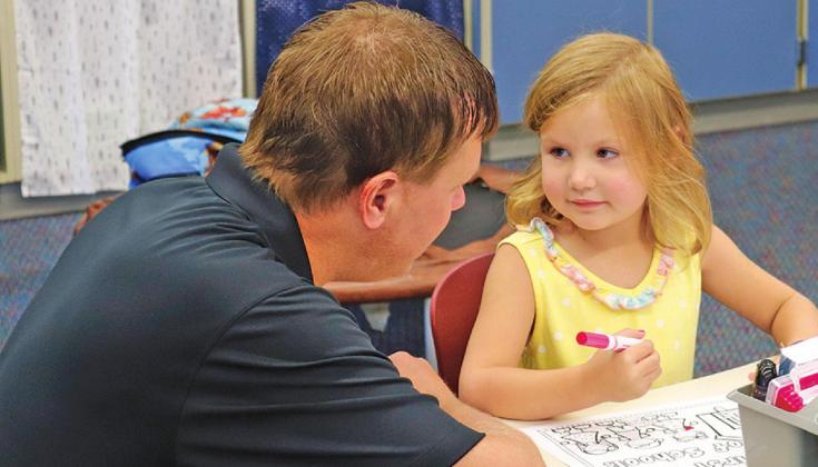 Jason Melland and daughter Berklee share a sweet moment as they say goodbye on the first day of school as she starts Kindergarten. VNV Photo by Lesa Van Camp