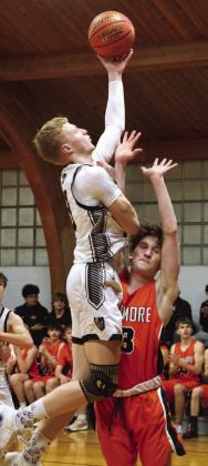 Connor Hurtt goes up for two against Larimore's Russell McLean.