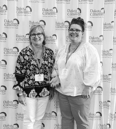 Kari Novack and Jenny Holand from Unity Medical Center with the R-COOL-Health Scrubs Camp of the Year award.