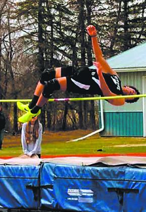 Mason Pollestad clears the high jump at the HCV meet, setting a new personal record at 5' 8'. Photo by Jamie Rarick