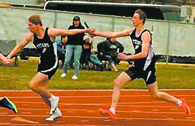 In the boys 4x200 relay at the HCB meet, Carter Johnson receives the baton from Jack Langerud. Along with Carter Oberg and Brady Reilly the team took first in the event, setting a new PR at 1:36.03. Photo by Jamie Rarick