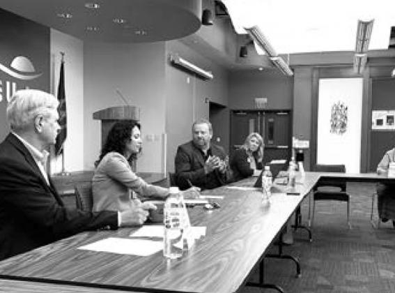 North Dakota Farmers Union President Mark Watne, middle, talks about market concentration in the cattle industry to Xochitl Torres Small, USDA’s undersecretary for rural development, Monday, June 27, at the NDFU state office in Jamestown. At left is Sen. John Hoeven; second from right is USDA Rural Development State Director Erin Hill-Oban; and at right is USDA Farm Service Agency State Director Marcy Svenningsen.