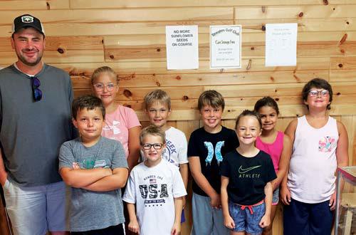 Some of the younger golfers pictured with Coach Chris are: Back row - RaeLee Kasprowicz, Knox Jensen, Owen Englund, Ciera Dalzell, Finn Pollestad. Front row - Domenic Stellon, Easton Bratlie, and Marley Schumacher.