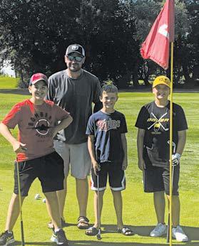 Pictured are Gavin Cole, Coach Chris, Asher McFarland, and Jaxon Woinarowicz.