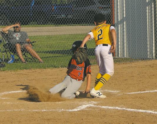 Jim Bishop slides into home. Photo by Rebecca Davis
