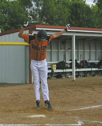 Johnny Osowski jumps out of the way of a pitchers throw during Thursdays game against Minto. Photo by Rebecca Davis
