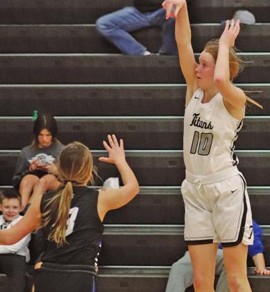 Easton Larson makes a three point attempt against Hatton Northwood in Drayton Thursday night. VNV photo by Lesa Van Camp