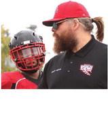 Coach Foster makes a point on the sidelines during Saturday's game. Not only was Saturday the coach's birthday - his wife gave birth to their first child on Friday.