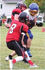 Jamie Laroque and Gavin Ryan tie up the Trenton ball carrier.