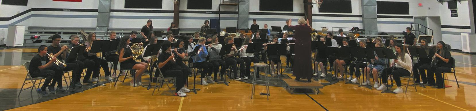 Last week, combined bands from Cavalier, Drayton, North Border, and Valley-Edinburg performed in the Pembina County Band Festival concert at the Valley-Edinburg High School gymnasium at 6:30. Music teachers took turns directing the musicians and in this photo Sue O’Neil of Drayton can be seen directing. Photo by Jeremy Ratliff.