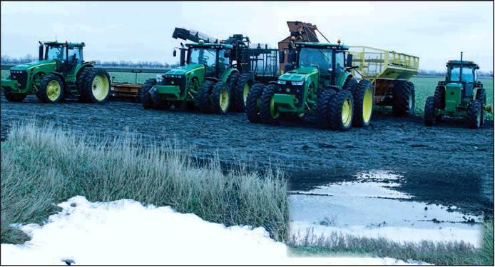 In a field NorthWest of Drayton equipment was waiting in a muddy field just waiting to start rolling again. Insert picture gives a clearer view of how many fields look with a mix of standing water, mud, and snow. VNV Photos by Lesa Van Camp