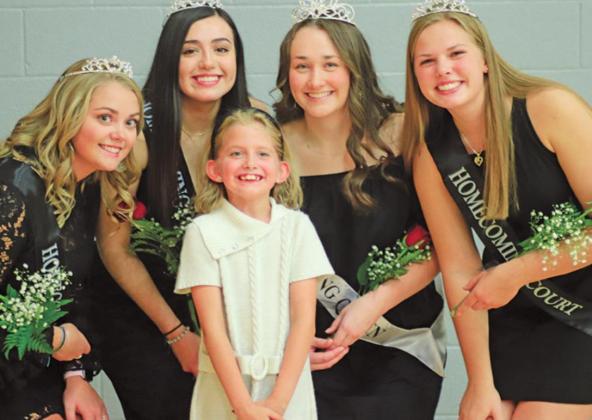 Following the ceremony there was a time for taking pictures. Pictured above left to right: is a possible future homecoming Queen posing for a picture with part of this years royalty Aliyah Bartles, Leslie Pena, Ruthie Rarick (in front), Queen Madison Hermanson, and Kasey Stegman. VNV Photo by Lesa Van Camp