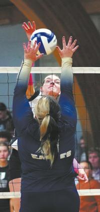 DVE senior Elizabeth Fedji spikes the ball for a point against North Border. Photo by Larry Stokke
