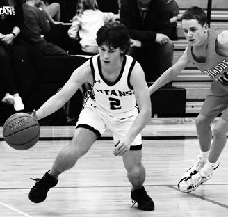 Logan Wieler works past a Larimore defender. Photo by Lyle Van Camp.
