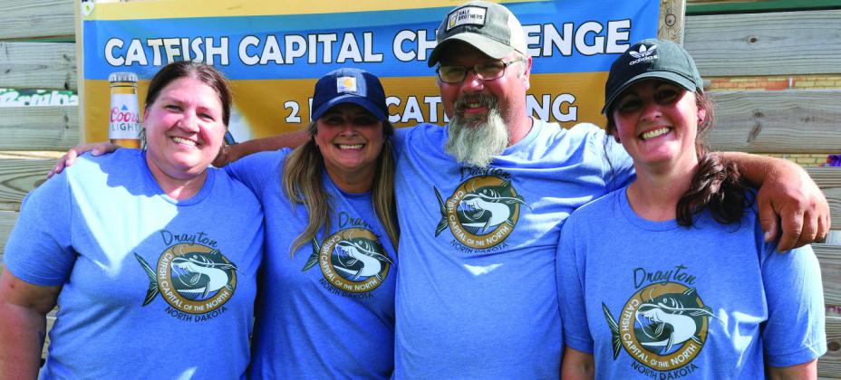 Mary Casmey, Nicole Weber, Brad Durick, and Shannon Hartwig came down from Grand Forks to assist with the tournament by weighing fish and organizing numbers. Not photographed, Madi Estad. Photo by Rob Boll.