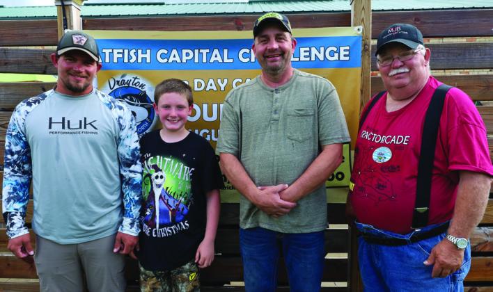 A first for the tournament - these two teams had four generations fishing in two boats last weekend. The Bachs come to the tournament from Iowa every year. (L-R) Dakota, Marcus, August, and Byron Bach. Photo by Rob Boll.
