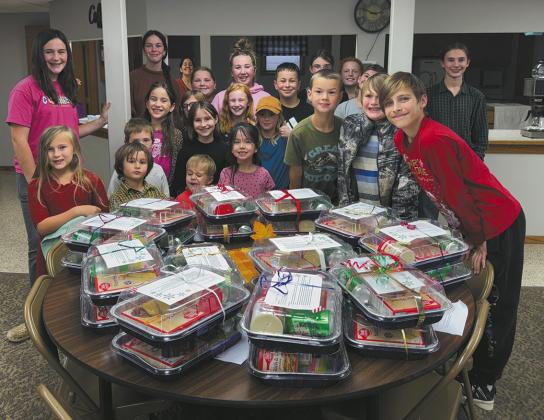 Crystal Clovers 4-H members show off their shelf-stable cake kits. Submitted photo.