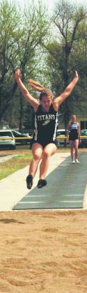 DVE freshman Violet Hoyles launches forward in womens long jump, finishing third with a personal record of 13' 8.5' in Larimore on May 10. Photo by Jamie Rarick.