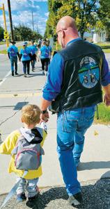 Paul Larocque walking with his grandson at the TEARS walk. Photo by Stormylynn Manley.