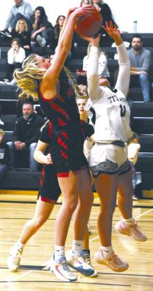 Jacey Nelson's shot is blocked by a Mustang defender. Photo by Lyle Van Camp