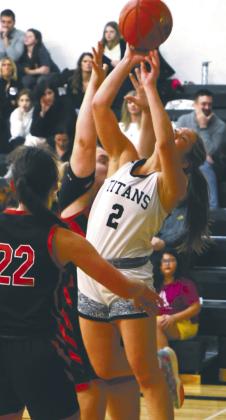 Brooke Gullickson shoots through a crowd against the Mustangs. Photo by Lyle Van Camp