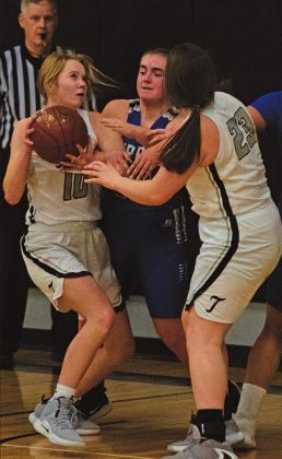 Easton Larson and Madison Hermanson battle under the basket with a couple Burros players. VNV Photo by Lesa Van Camp