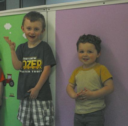 Children at the daycare were eager to have their pictures taken. Photo by Andrea Johnston