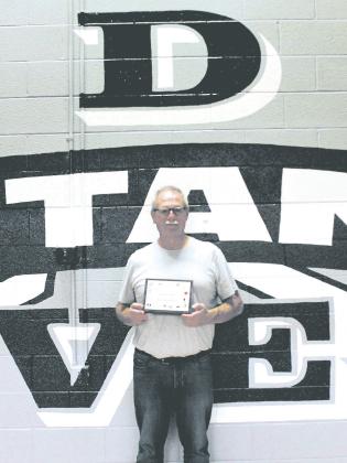 Drayton Coach Murph Thompson was recognized at Friday's volleyball game and presented with a plaque for 45 years of coaching service by the North Dakota High School Coaches Association. Photo by Jamie Rarick.