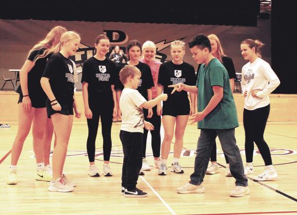 In a championship showdown, kindergartener Pearce took on sixth grader Noah in 'Rock, Paper, Scissors' and won in front of a cheering crowd. Photo by Jamie Rarick.