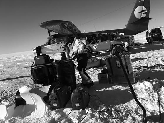One of the team making repairs with a portable welder and taking on fuel delivered by a ski-equipped Dash 7 turboprop airplane. Photo contributed by Jon Solberg.