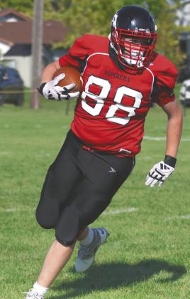Braydon Klimpel picks up some yards for the Bombers. Photo by Lyle Van Camp