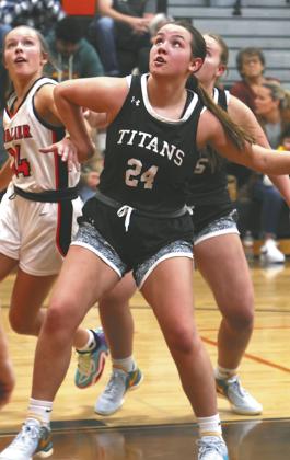 Hailey Berg fights for position on a rebound.