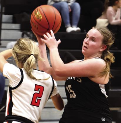 Aleah Pokrrzywinski steals the ball from Cavalier's Graesen Helgoe