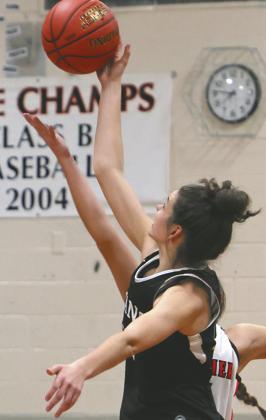 Elizabeth Fedje wins the opening tip off of the 2023/24 Titans Girls Basketball season.