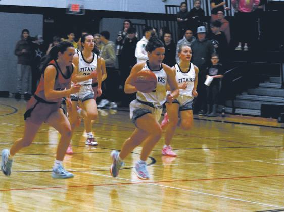 DVE junior Brooke Gullickson strips the ball and breaks away from the pack. Photo by Jamie Rarick
